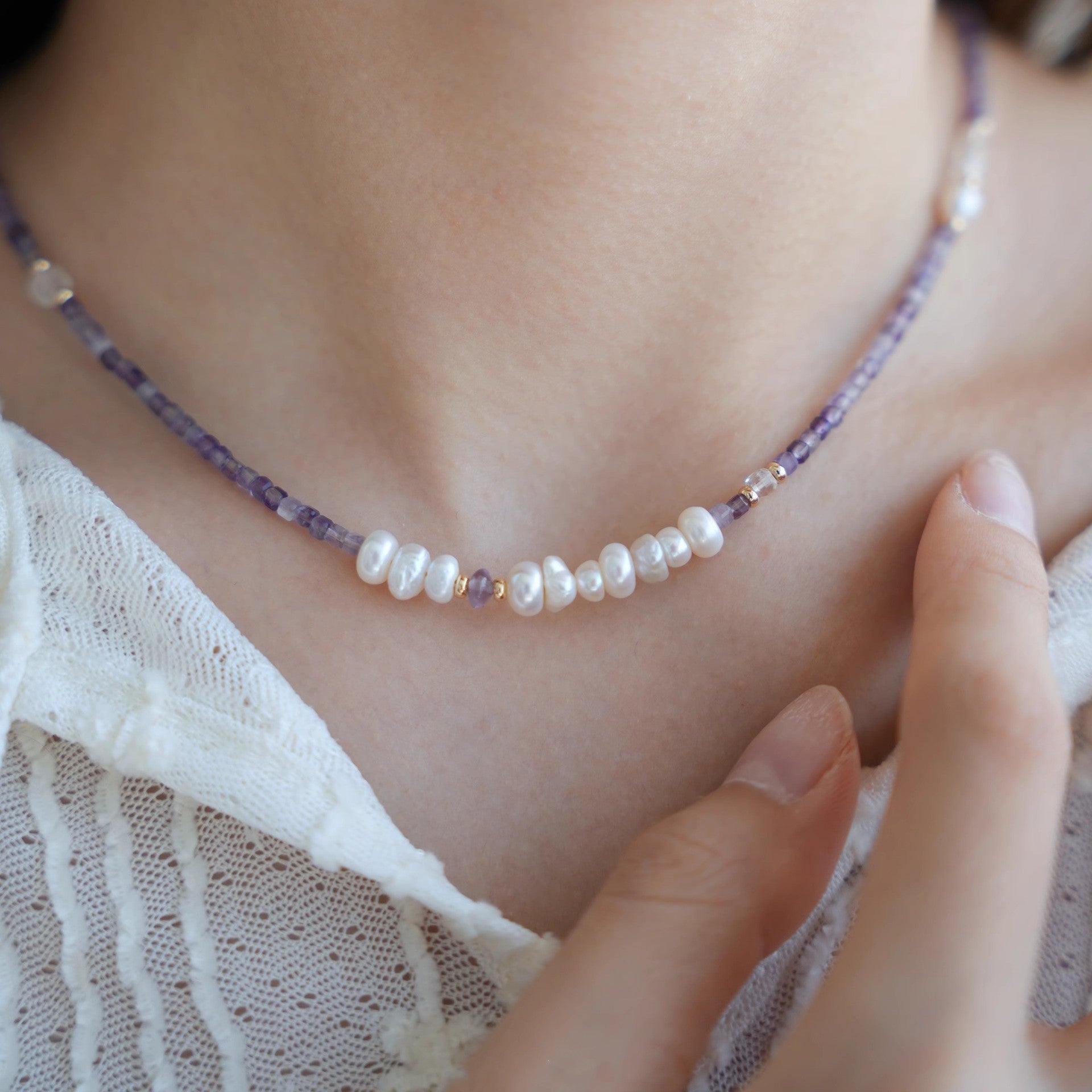 Amethyst and freshwater pearl necklace worn at the collarbone