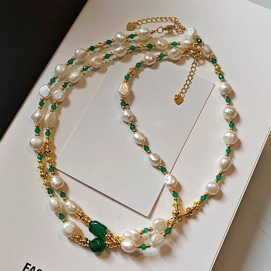Baroque pearl and green chalcedony renewal necklace arranged on a neutral card