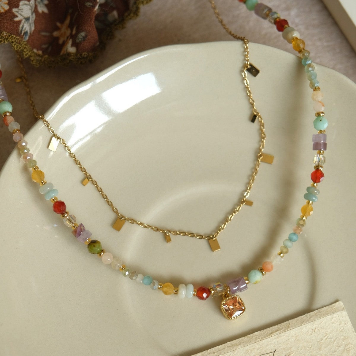 Rainbow crystal beaded necklace with gold-tone charm