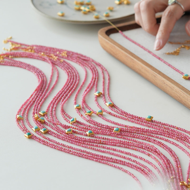 Rhodochrosite and turquoise heart necklaces being handcrafted